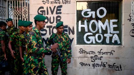 Sri Lankan Army soldiers patrol near the official residence of President Gotabaya Rajapaksa three days after it was stormed by anti-government protesters in Colombo.