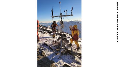 The team doing maintenance on the weather station located at South Col. 