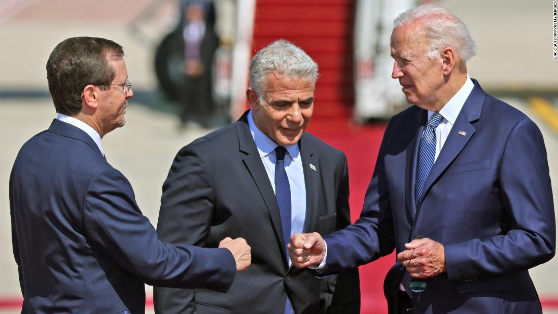 After Air Force One arrived in Israel, Biden was greeted by Israeli President Isaac Herzog, left, and Prime Minister Yair Lapid. The White House said the fist bumps are &lt;a href=&quot;https://www.cnn.com/2022/07/13/politics/handshakes-joe-biden-israel/index.html&quot; target=&quot;_blank&quot;&gt;part of an effort to reduce physical contact&lt;/a&gt; amid the rapid spread of a new coronavirus variant.