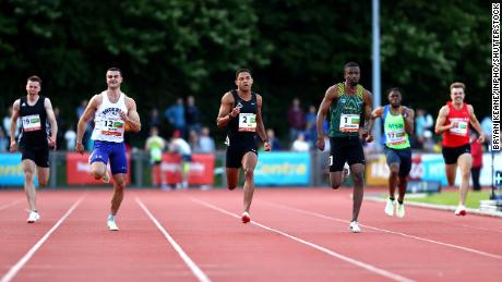 Ireland's Leon Reid (center left) and South African Anaso Jobadwana (center right) compete in Cork City Sports at the Munster University of Technology track and field stadium in Ireland on July 5.