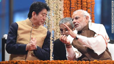 Shinzo Abe meets Indian Prime Minister Narendra Modi on the banks of the Ganges River in Varanasi in December 2015.