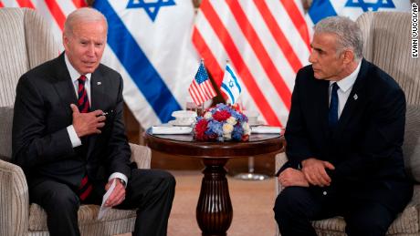 President Joe Biden, left, and Israeli Prime Minister Yair Lapid address the media following their meeting in Jerusalem Thursday, July 14, 2022. (AP Photo/Evan Vucci)