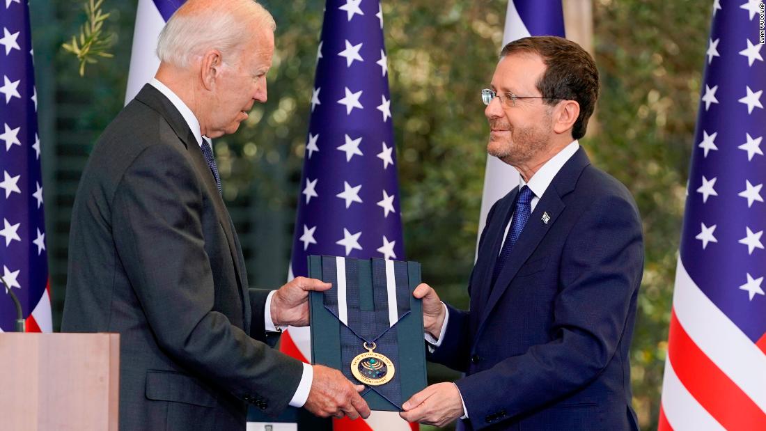 Israeli President Isaac Herzog awards Biden with the Israeli Presidential Medal of Honor on Thursday. Biden, who was recognized for his longtime support of Israel, said it was &quot;among the greatest honors of my career.&quot;