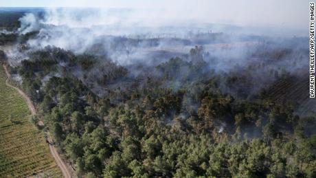 A forest fire burns through vegetation in Landiras, southwestern France, on July 13.