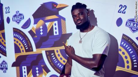 Ojabo points to the Ravens logo after being drafted. 