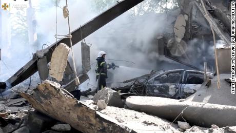 Firefighters work to extinguish a blaze after a Russian military strike in Mykolaiv in mid-July.