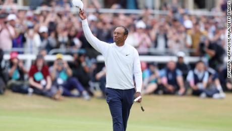 Tiger Woods acknowledges the crowd on the 18th hole during day two of The 150th Open.