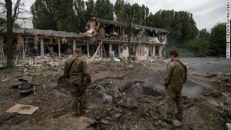 Ukrainian service members inspect a crater left by a Russian missile strike, as Russia&#39;s attack on Ukraine continues, in Dnipro, Ukraine July 16, 2022.  REUTERS/Mykola Synelnykov