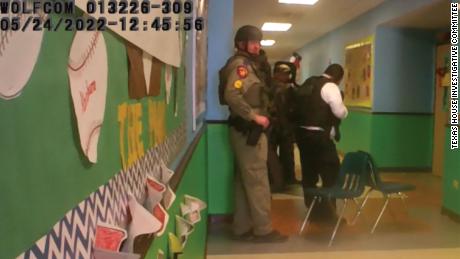 This photo released by the Texas House of Representatives Investigative Committee on the Robb Elementary Shooting responders stack in hallway south of Rooms 111 &amp; 112.