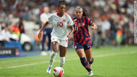 Canada&#39;s Ashley Lawrence battles for the ball with US forward Sophia Smith during the Concacaf W final.