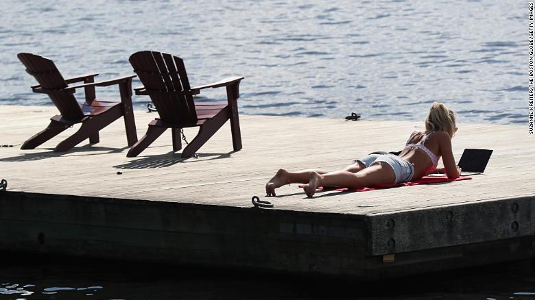 Boston, MA - Warm weather brought people out to the Esplanade in Boston in June.