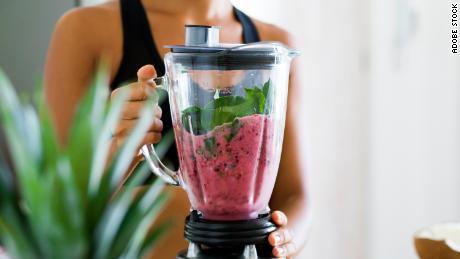 A green smoothie made with spinach, berries, banana and almond milk starts your morning.