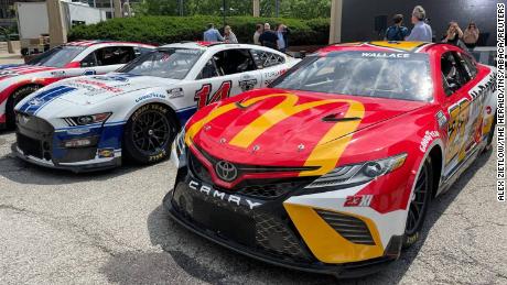 The NASCAR Cup Series cars of Bubba Wallace (No. 23), Chase Briscoe (No. 14) and Ross Chastain (No. 1) lined up in Chicago ahead of Tuesday&#39;s announcement.