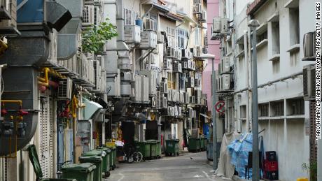 Air conditioning units line a narrow alleyway in central Singapore.