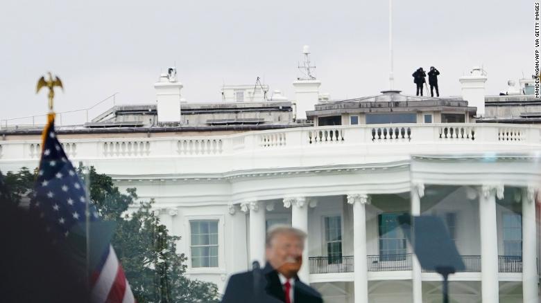 Members of the Secret Service patrol from the roof of the White House as then-President Donald Trump spoke to supporters from the Ellipse on January 6, 2021.