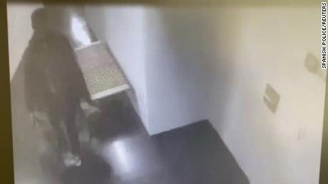 Security cameras captured a man leaving the premises.