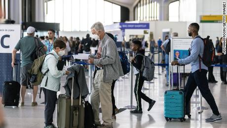 NEWARK, NJ - JULY 01: Travelers line up to check in for United Airlines flights at Newark Liberty International Airport (EWR) on July 1, 2022 in Newark, New Jersey. Hundreds of flights were canceled across the US ahead of July Fourth weekend.