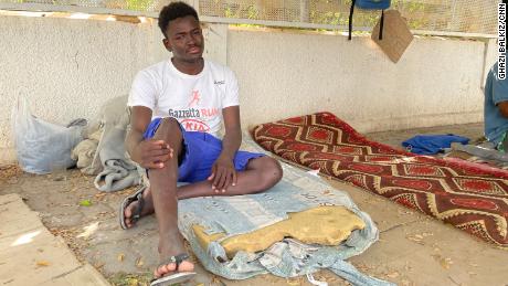 Abuboker Juma, originally from Darfur in Sudan, was among a group of about 50 migrants from several African nations seen outside the IOM compound in Tunis.