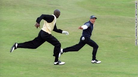 Garcia leads Jordan in a sprint down the 16th St. Louis Fairway.  Andrews' old field during the Alfred Dunhill Pro-Am Cup, 1999.
