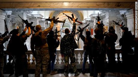 Gun rights activists carrying semi-automatic firearms pose for a photograph in the state Capitol Building on January 31, 2020, in Frankfort, Kentucky. 