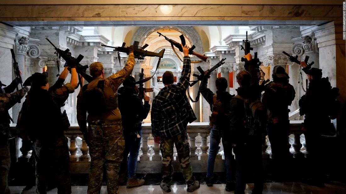 Gun rights activists carrying semi-automatic firearms pose for a photograph in the state Capitol Building on January 31, 2020, in Frankfort, Kentucky. 