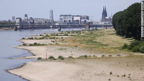 Banks and low waters of the Rhine seen during a heat wave on July 18, 2022 in Cologne, Germany.