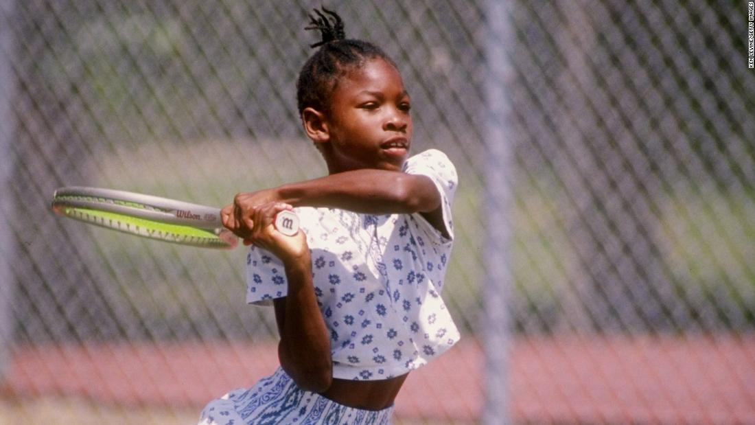 Serena plays tennis in 1992. She and her sister spent their early years playing tennis in Compton, California, just outside of Los Angeles. They later moved to a tennis academy in Florida.