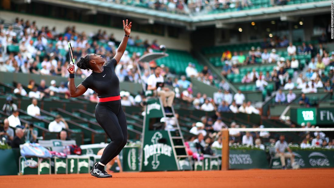 Williams serves during a French Open match in 2018. A controversy erupted at the tournament when Williams wore a catsuit in her first grand slam match since becoming a mother. Shortly after the tournament, the French Tennis Federation instituted a dress code that critics denounced as racist and sexist.
