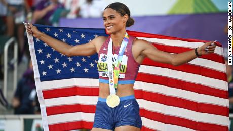 Sydney McLaughlin celebrates her victory with her gold medal.