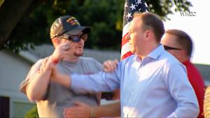 In this image taken from video provided by WHEC-TV, David Jakubonis, left, brandishes a sharp object as he attacks U.S. Rep. Lee Zeldin, right, as the Republican candidate for New York governor delivered a speech in Perinton, N.Y., Thursday, July 21, 2022. Jakubonis, 43, has been charged with attempted assault, arraigned and released, a Monroe County sheriff&#39;s spokesperson said. (WHEC-TV via AP)