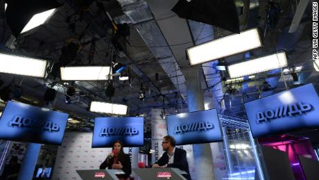 Co-owners of cable channel Dozhd (TV Rain), Natalya Sindeyeva (L) and Alexander Vinokurov  (R) attend a press conference at the channel office in Moscow , on February 4, 2014. Russia&#39;s top opposition cable channel Dozhd (TV Rain) known for its critical coverage of Putin faced today the prospect of closure after a major cable operator said it would take the station off the air. AFP PHOTO/ VASILY MAXIMOV        (Photo credit should read VASILY MAXIMOV/AFP via Getty Images)