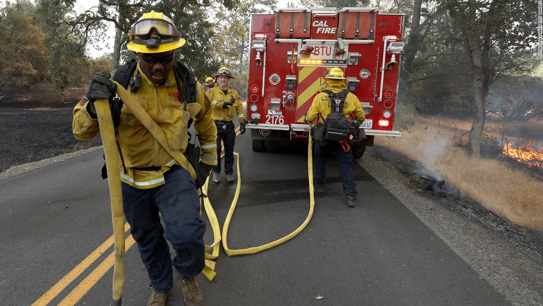 Firefighters battle the blaze near Mariposa on Saturday.
