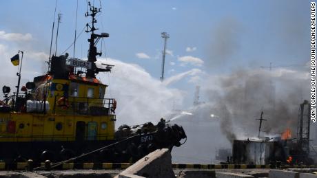 Firefighters work at a site of a Russian missile strike in a sea port of Odesa, as Russia&#39;s attack on Ukraine continues, Ukraine July 23, 2022.  Press service of the Joint Forces of the South Defence/Handout via REUTERS ATTENTION EDITORS - THIS IMAGE HAS BEEN SUPPLIED BY A THIRD PARTY.