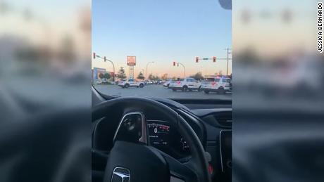 Jessica Bernardo told CNN she was driving to work when several police cars parked in front of her vehicle and stopped traffic  in Langley.
