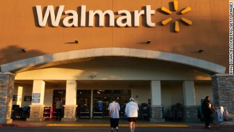 Walmart cuts prices on clothing and other products, lowers revenue forecast due to lower consumer spending.