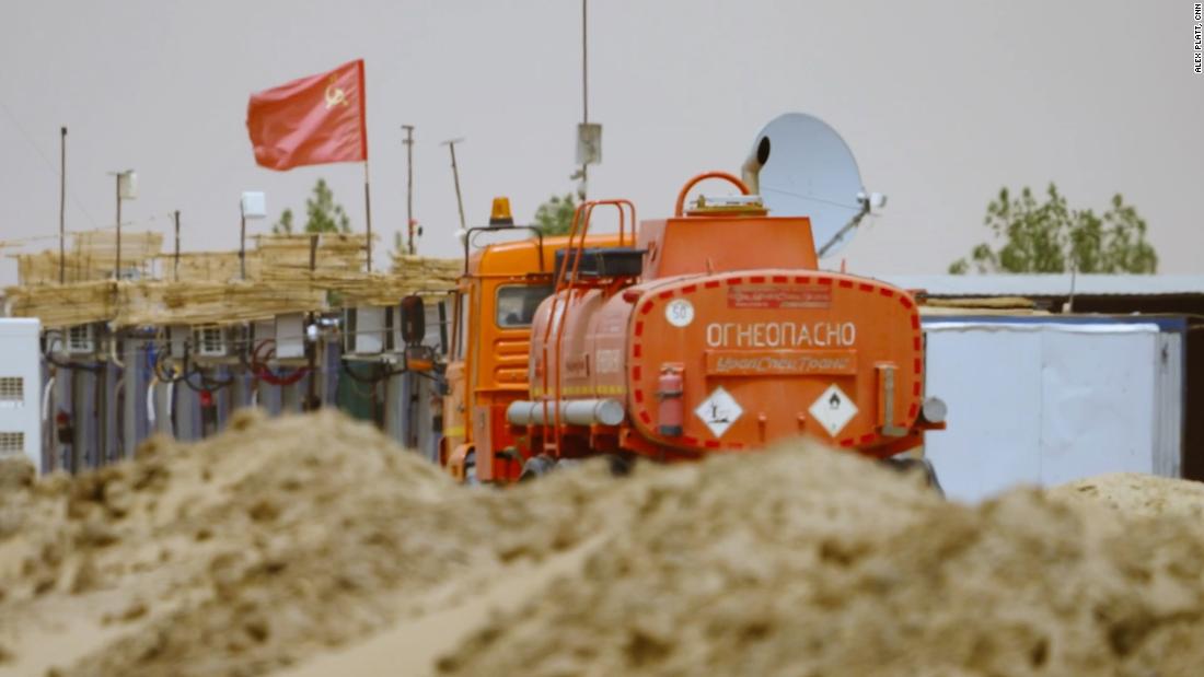 A Soviet flag flies over the processing plant deep in the Sudanese desert, a facility known to locals as the &quot;Russian company.&quot;