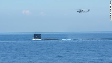 A helicopter and a submarine take part in Taiwan&#39;s live-fire military drills on July 26.
