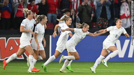 England celebrates after Lucy Bronze scores the second goal.