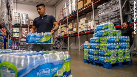 A customer stocks up on bottled water in a Sam&#39;s Club during a heatwave in Houston, Texas. 