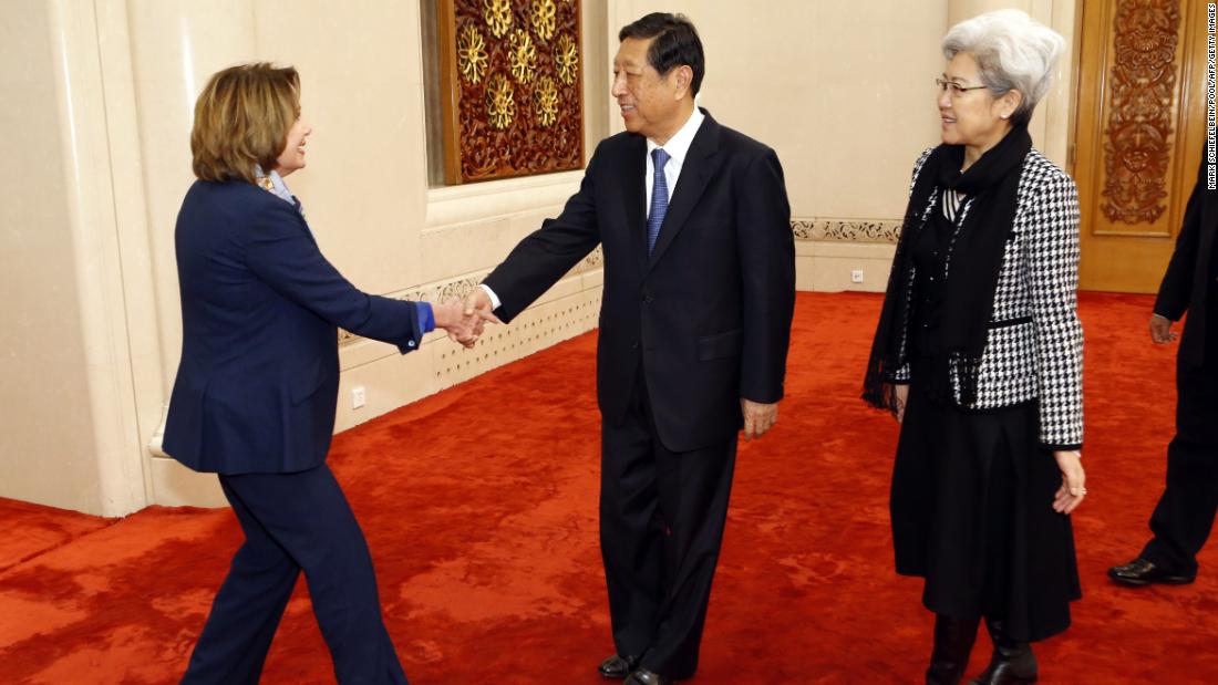 Pelosi shakes hands with Zhang Ping, vice vhairman of China&#39;s National People&#39;s Congress, as she arrives for a bilateral meeting at the Great Hall of the People in Beijing in November 2015. At right is Fu Ying, head of the NPC&#39;s foreign affairs committee.