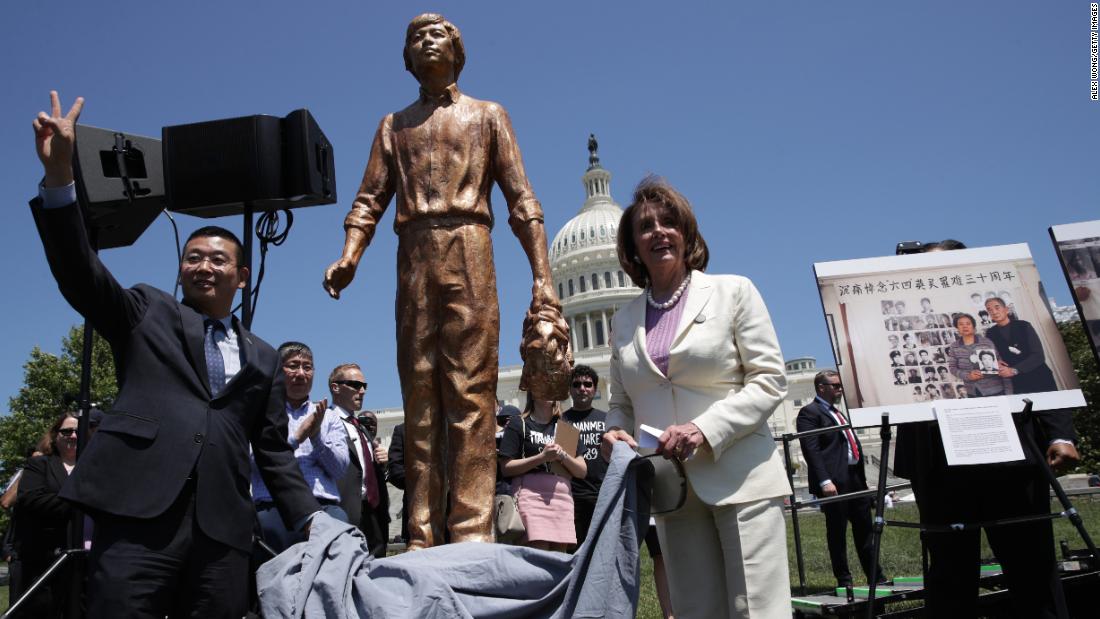 Pelosi and Chinese dissident Yang Jianli unveil the &quot;Tank Man&quot; statue during a 2019 rally in Washington, DC, to mark the 30th anniversary of the Tiananmen Square protests.