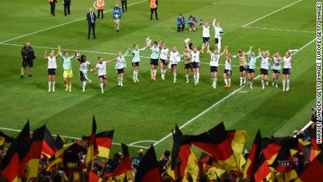 German players celebrating after the final whistle. 