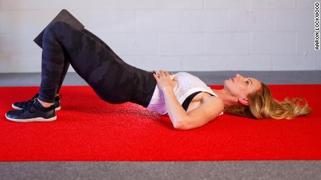 Prevent your lower back from arching by using the strength of your core and glutes.