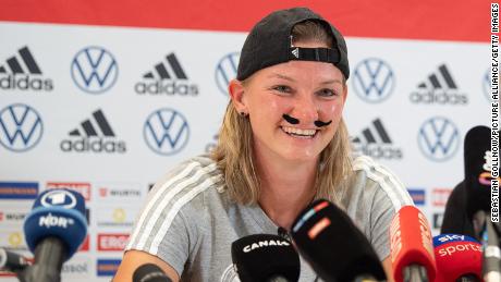 Alexandra Popp wore a false mustache to the pre-match press conference on Friday.