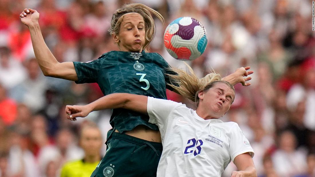 England&#39;s Alessia Russo, right, vies for the ball with Germany&#39;s Kathrin-Julia Hendrich.