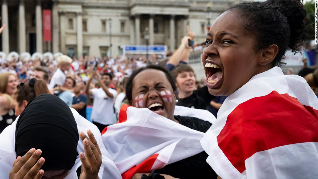 England fans react at Trafalgar Square in London after England scores a goal.