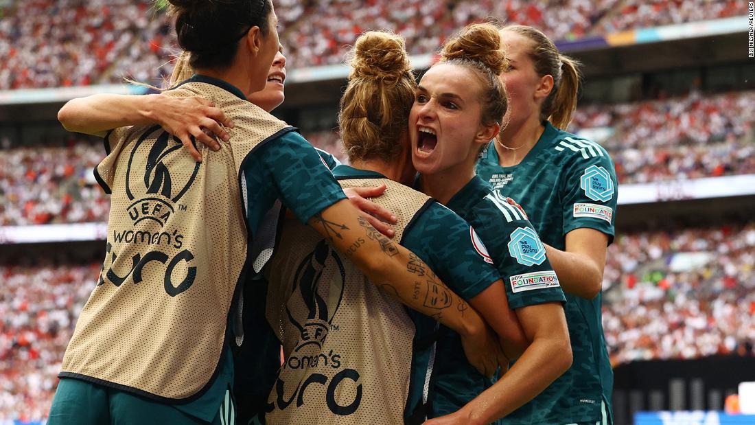 Germany&#39;s Lina Magull celebrates scoring the team&#39;s first goal with teammates.