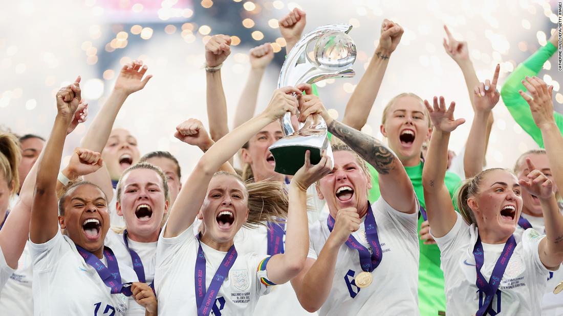 England&#39;s Leah Williamson and Millie Bright lift the UEFA Women&#39;s EURO 2022 Trophy after their team&#39;s victory.