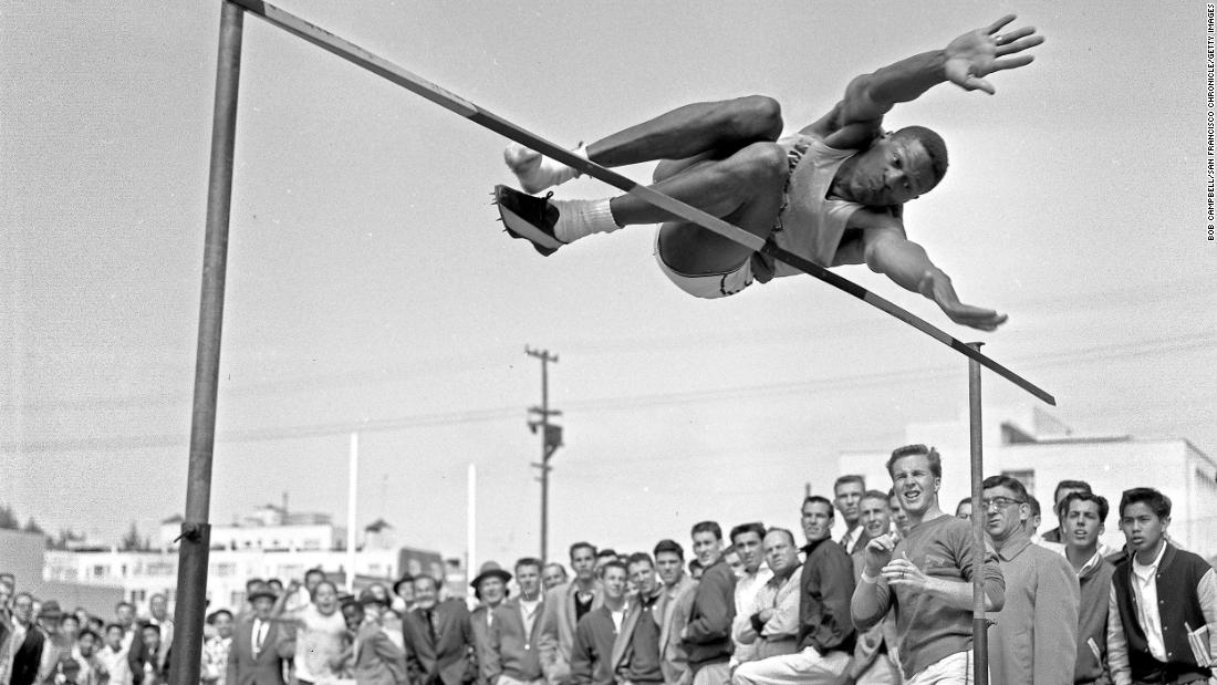 Russell competes in the high jump for University of San Francisco during a track meet in April 1956. In the same month, Russell would be selected second overall in the NBA draft by the St. Louis Hawks, before being traded to the Boston Celtics.