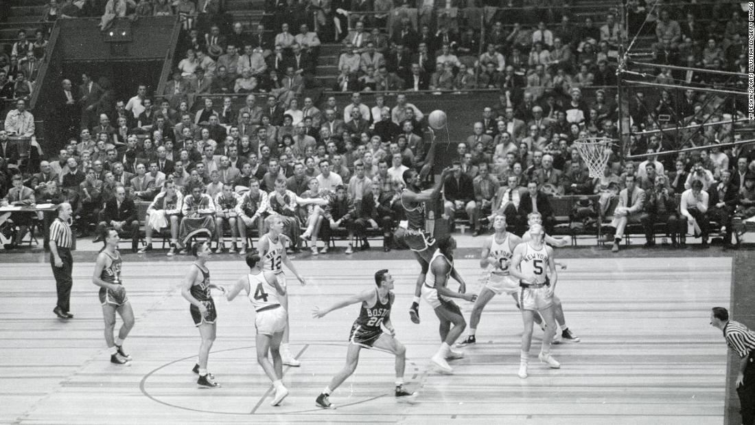 Russell takes a shot during a game against New York in 1957. Russell played his entire career as a center for Boston.